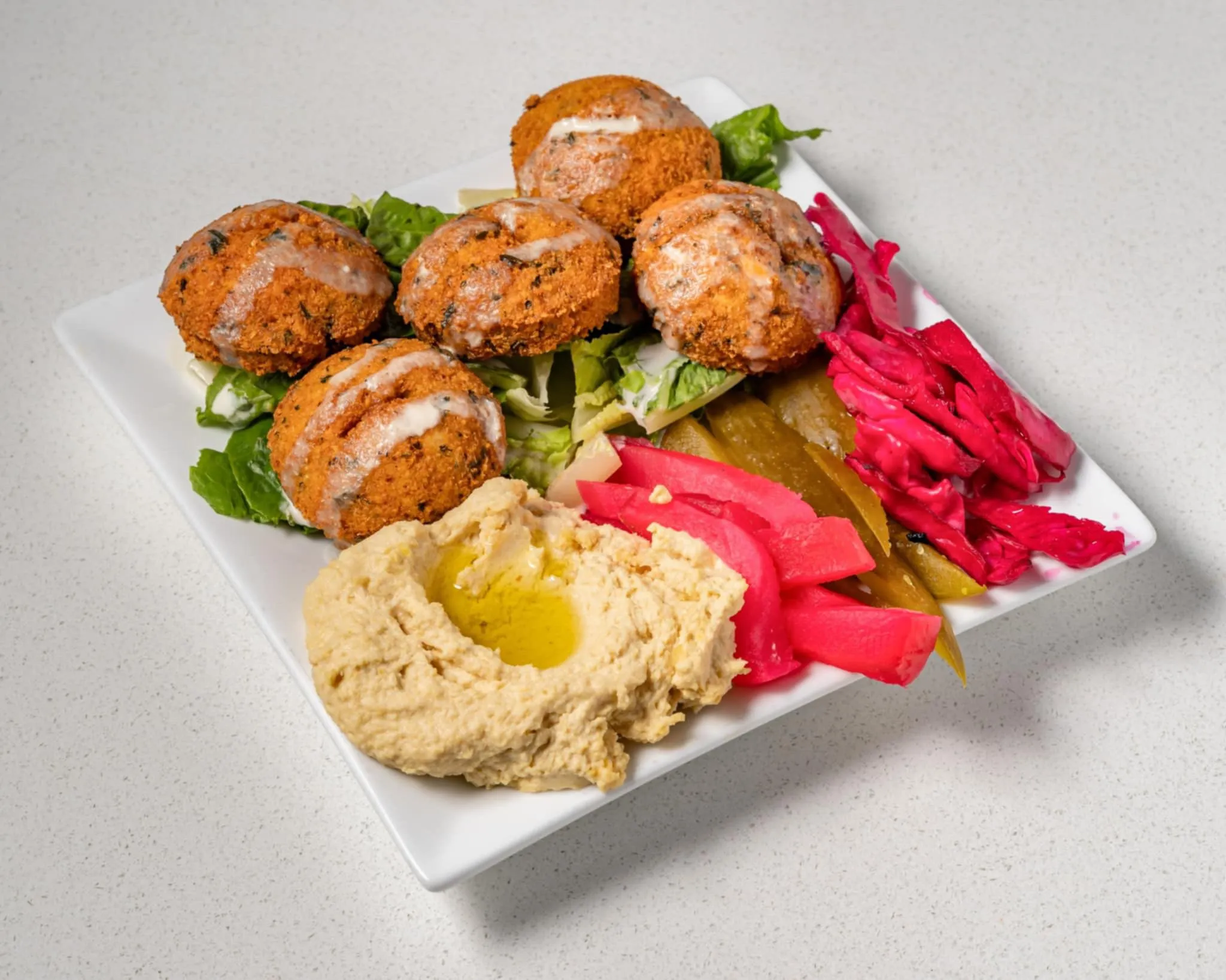 Falafel with tahini and fresh vegetables at Baladna Restaurant and Bakery in NE Calgary